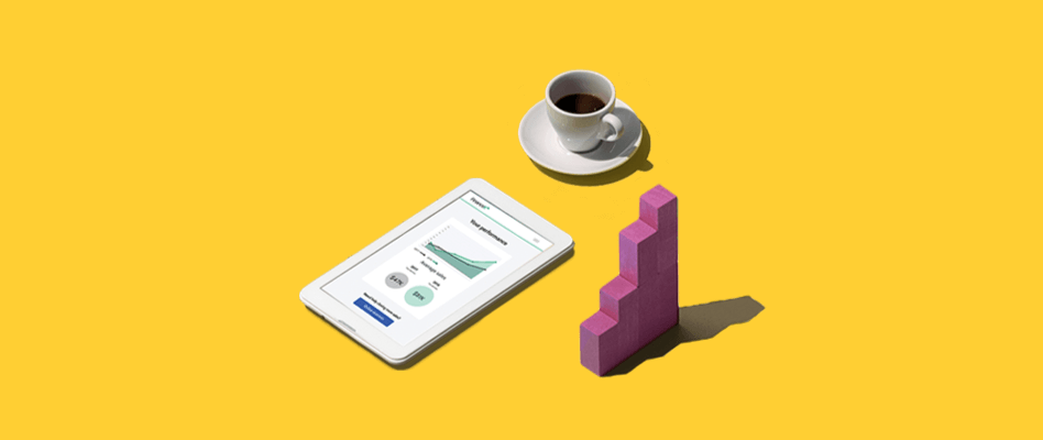 Coffee cup and tablet on yellow background